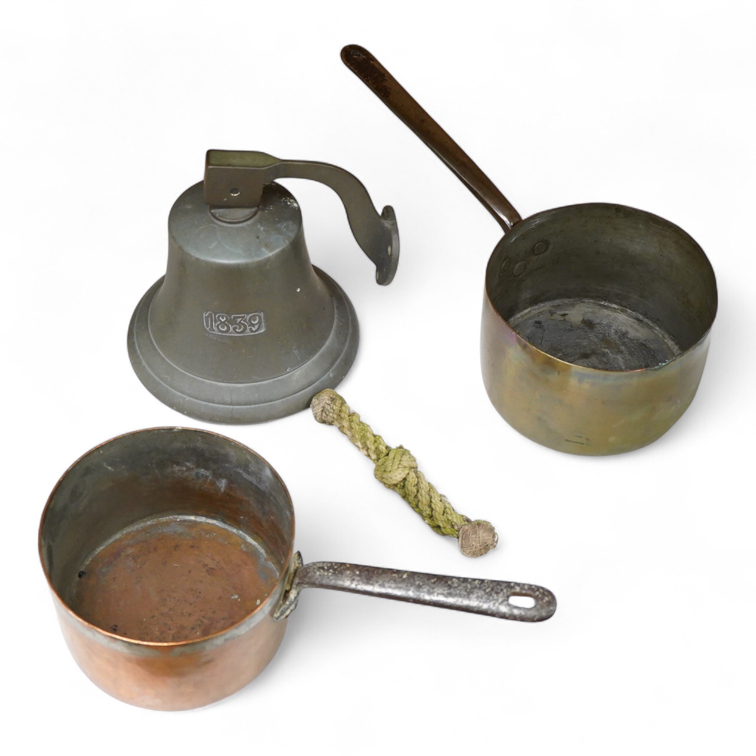 A bronze bell dated 1839 and two Victorian copper and brass saucepans
